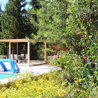 09 Giorgos pool terrace with flowerbeds and covered dining area