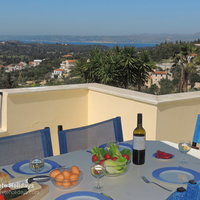 11 Iremia upstairs dining terrace with sea view.