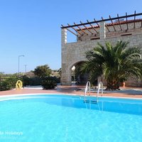 12 Villa Chrisi pool terrace and archway to downstairs covered terrace