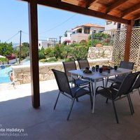 09 Villa Jeni front covered dining terrace with steps to the pool terrace.