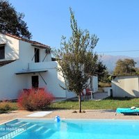 02 Plane Tree House with mountain backdrop.